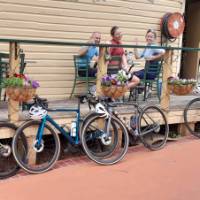 A happy group of cyclists enjoying the local cuisine. | Shawn Flannery