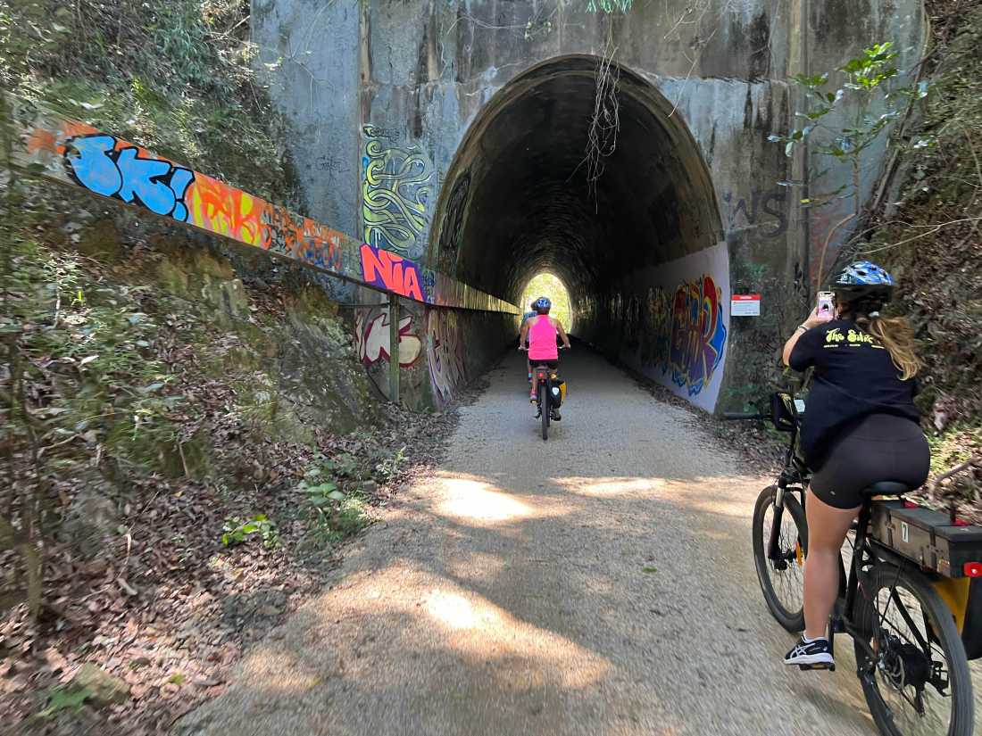 Cyclist entering tunnel on the northern rivers rail trail | Kate Baker
