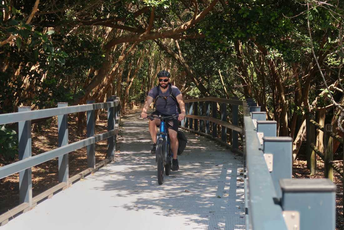 A cyclist on the Coastal Cycle Path between Pottsville and Kingscliff | Erin Wileman