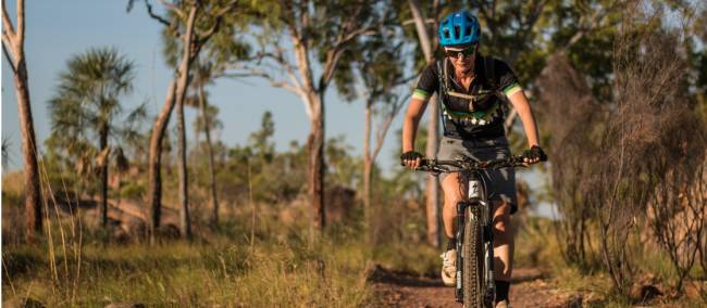 Cycling among the gum trees in the Northern Territory. | <i>Travis Deane</i>