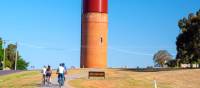 Cycling past the Rutherglen Wine Bottle on the Murray to Mountains Rail Trail | Ride High Country