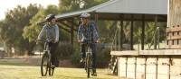 Riding past Yea Station on the Great Victorian Rail Trail | Ride High Country