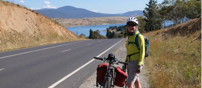 Cyclist on the Barry Way with view of Lake Jindabyne | Ross Baker