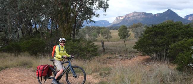 Cyclist at a viewpoint in the Capertee Valley | Ross Baker